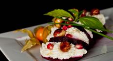 Beetroot mille-feuille with cream cheese, pomegranate and pine nuts from DoZari Restaurant