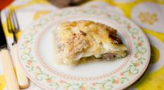 Potato pie with mincemeat and mushrooms